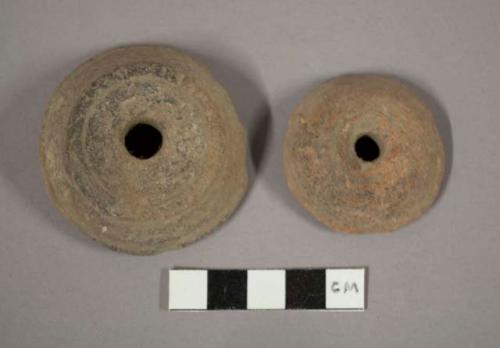 Large pottery spindle whorls with incised lines