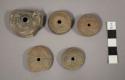 Pottery spindle whorls- molded decoration