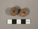 Plain terra cotta spindle whorls or beads