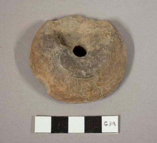 Large incised pottery spindle whorl