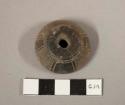 Incised and punctated pottery spindle whorl