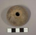 Large pottery spindle whorl- incised lines and stamped decoration