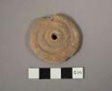 Crude molded (?) pottery spindle whorl