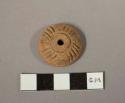 Small terra cotta spindle whorl- decorated