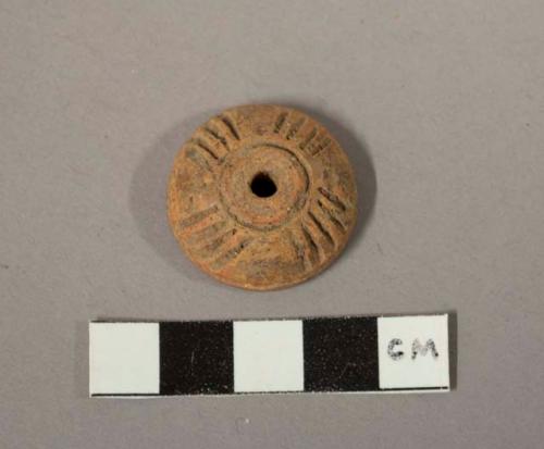 Small terra cotta spindle whorl- decorated