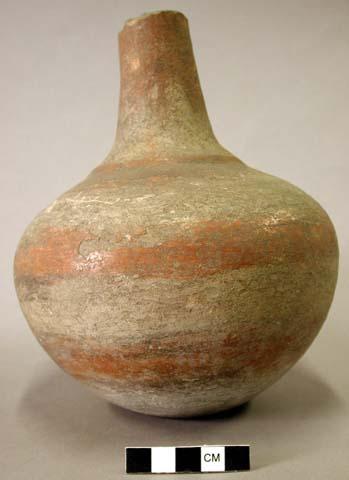 Ceramic vessel, long neck, neck broken at rim, red and black slip decoration, ri