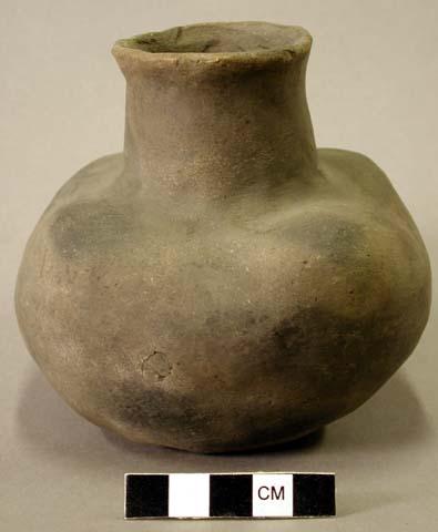 Ceramic complete vessel, medium neck, flared lip, four lobes around shoulder, fl