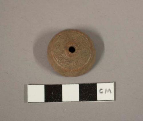 Spindle whorl - stamped