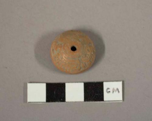 Carved tan pottery spindle whorl