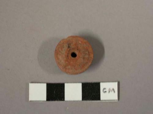 Fragmentary terra cotta ear plug