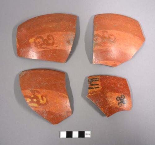 Fragments of pottery decorated with figure of triskele