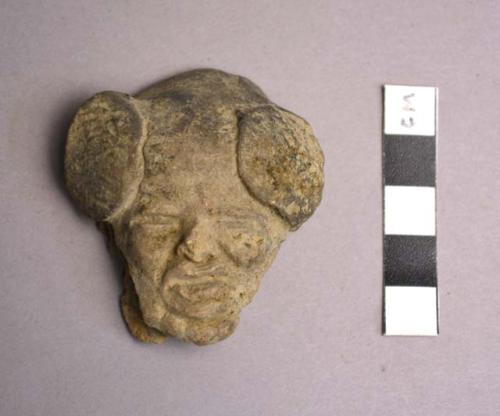 Pottery head from three-handled suspension bowl