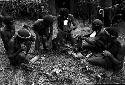 Wali, Milika, Pumika and others cooking a pig for the feast given by Wali and Wereklowé