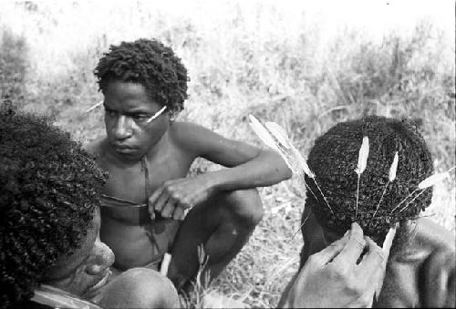 Walimo putting more feathers in Yegé Asuk's hair