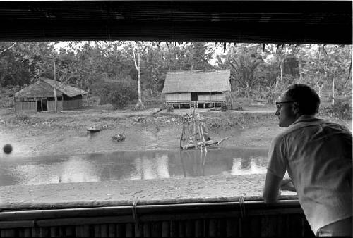 Dr. A. A. Gerbrands leaning out of a window at his house at Ammanamgai