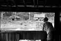 Dr. A. A. Gerbrands leaning out of window of his house at Ammanamgai