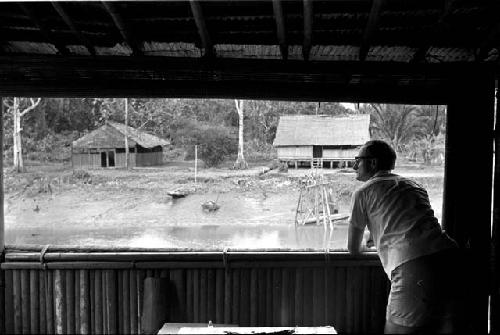 Dr. A. A. Gerbrands leaning out of window of his house at Ammanamgai