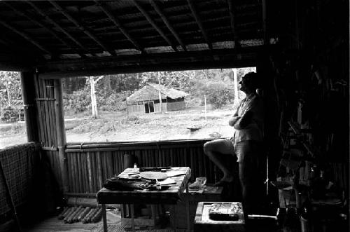 Dr. A. A. Gerbrands at a window of his house at Ammanamgai