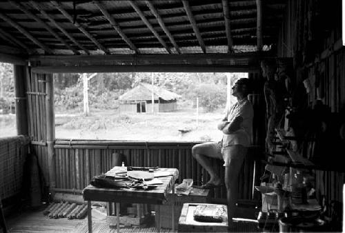 Dr. A. A. Gerbrands at a window of his house at Ammanamgai