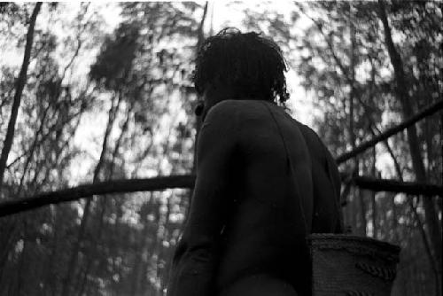 A paddler resting in a mangrove swamp