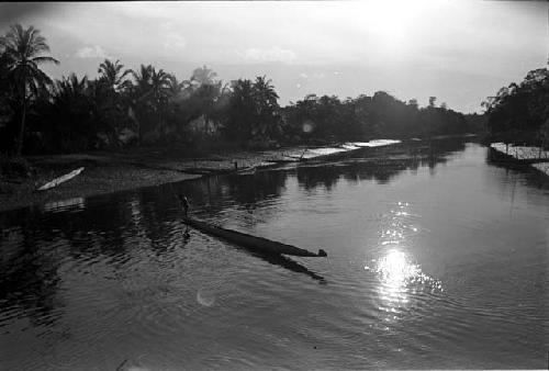 A canoe in the water at low tide