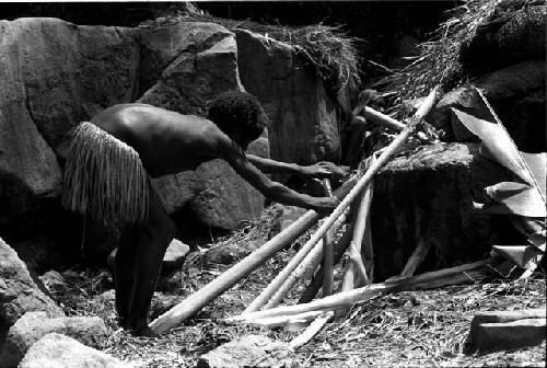 Child at salt well preparing haki to dip in the well