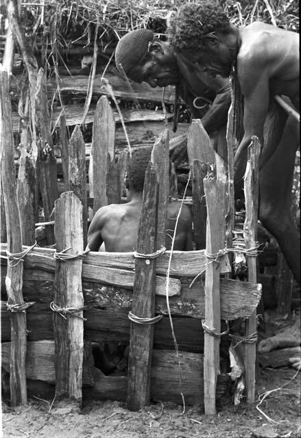 Asuk, Yohonoroik and other men remaking the welleleget (waroleget) during the wamkanneke at Tekman Biok's sili