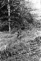 Distance shot of two children throwing arrows at each other