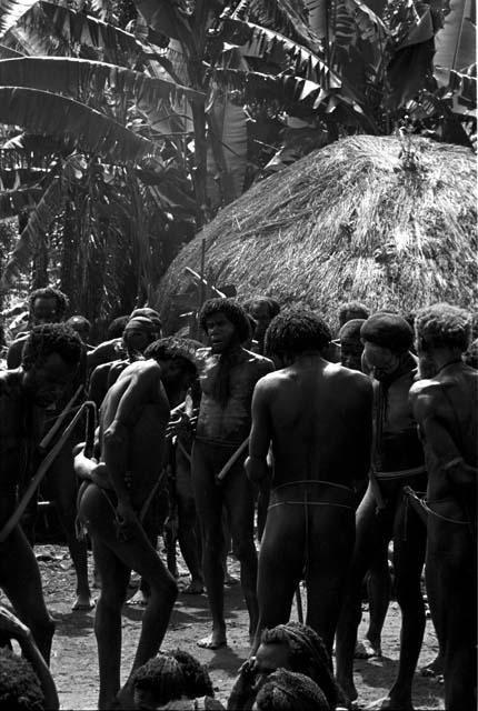 Men mourning at Yonokma's funeral