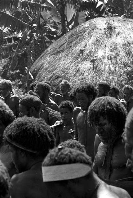 Asikanilep and other men mourning at Yonokma's funeral