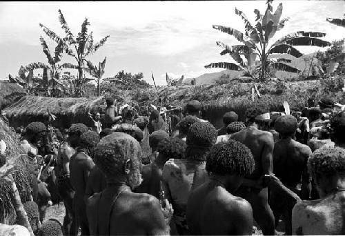 Past men towards the pia at Yonokma's funeral