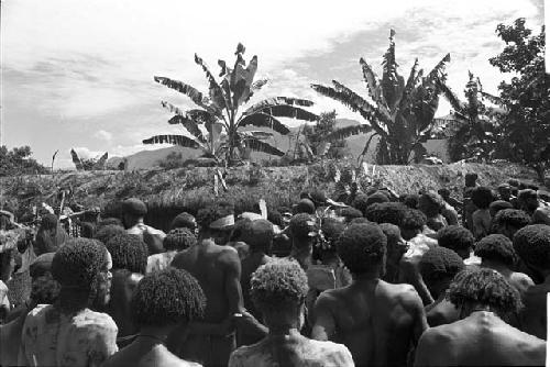 Over the heads of a great many men at Yonokma's funeral