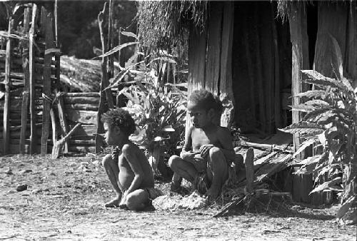 Two little children watch the ceremony of Yonokma's funeral