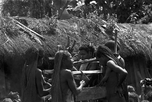 Women mourn around Yonokma's corpse at his funeral