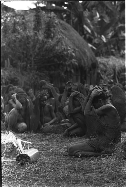 Women wailing at Yonokma's funeral as he burns on the pyre