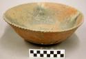 Ceramic bowl with black-stepped and fan-like design on interior, punctate patter