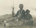 Navajo woman and boy sitting