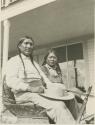 Ed Ladd, a Jicarilla Apache sitting with a Santa Clara Pueblo Indian man