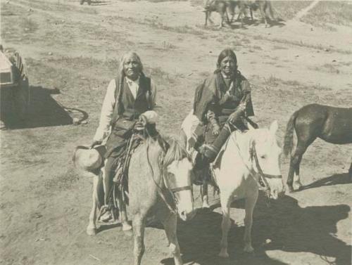 Old Gasa Maria and his wife on horses