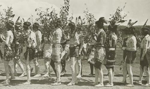 Jicarilla Apache men in ceremonial costume at agency in southwest Colorado