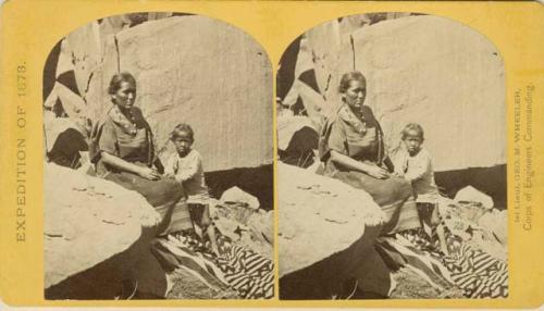 Navajo woman and her child at home