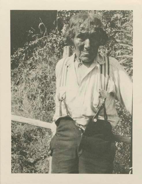 Portrait of Old Dandy, leaning on a fence post