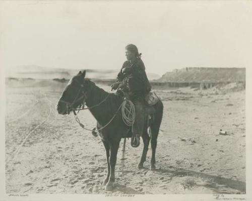 Navajo man on horse