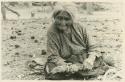 Navajo woman holding pinon gum mop used for post-firing treatment of vessels