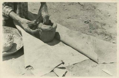 Tschopik pottery making. Adding fillet to the base