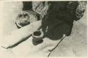Navajo woman rolling a fillet of paste to make a pot