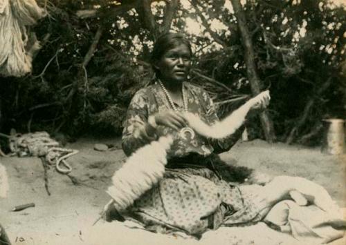 Woman spinning wool