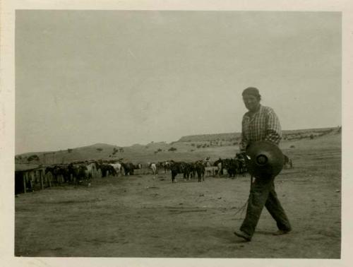 Navajo Man, horses in background