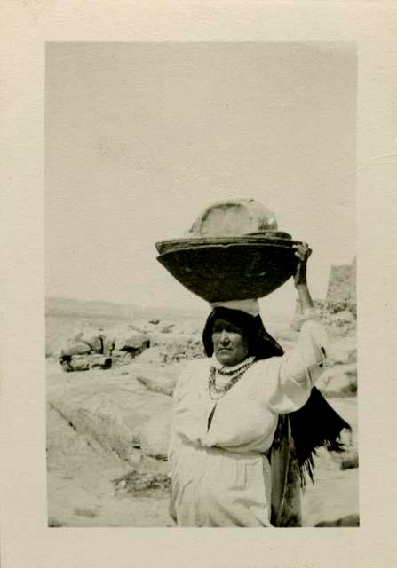 Acoma Pueblo woman carrying Miss Nicholson's stuff