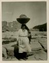 Acoma Pueblo woman carrying out old baskets and rare old drum
